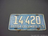 Front view of the 1963 British Columbia license plate showing number 14-420 with visible rust spots and wear.