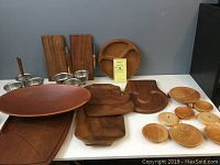 Wooden carving boards, cheese boards, segmented serving tray, and part of the ceramic dish