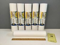 Six rolls of white Duck Smooth Top Easy Liner shelf liner, five full rolls with original labels and one partial roll, displayed alongside a ruler and note showing measurement details.