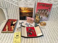 Full lot showing religious books, rosaries, crosses, carved figures, and souvenirs.