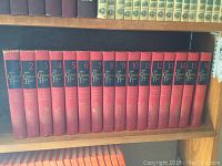 Spine view of all 16 volumes in The Children's Hour book series