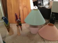 Working lamp with two shades, pink and green, showing overall lamp and shades from distance
