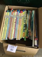 Box containing multiple Time Life educational children's books arranged by spine, colorful with various themes and numbered collection.