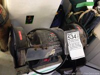 Image of a mounted Jobmate 6 inch bench grinder showing the overall device, grinding wheels, and protective guards.