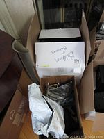 Boxes containing various cables and accessories for electronics