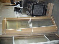 Packaged aluminum sliding window in cardboard box strapped with plastic bands