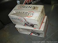 Two boxed Centro deep fryer kits stacked, one box showing creasing and tear