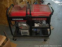 Left-side view showing Honda branding, EB10000 model label, fuel tank and frame