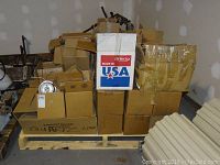 Full skid packed with multiple cardboard boxes containing various electrical and pot light parts; one box marked Cantech Made in USA.