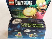 Front image of LEGO Dimensions packaging showing Krusty the Clown, a pie, and indications it is a Simpsons themed building toy set.