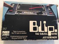 Box showing product name, picture of game, and branding with signs of wear and tear