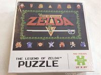 Front of the sealed box showing 550 piece puzzle with pixelated Zelda title screen art and puzzle size (18x24 inches).