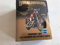 Front of the box showing image of Harley-Davidson motorcycle and details about the factory set of 100 premium collector's cards Series 1 including hologram enclosed sticker.