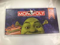 Top of the Monopoly Shrek Collector's Edition box showing Shrek character artwork and branding.