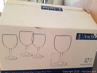 Original box showing anchor brand and line drawing of wine glasses. Box states 12 pieces 10.5 oz.