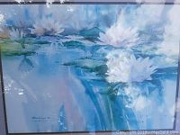 Close-up of upper section showing water lily blossoms and signature area