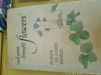 Hardcover book titled 'and some brought flowers' Plants in a New World with botanical illustration on cream cover