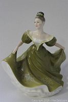 Front and side view of the Royal Doulton Lynne figurine, showing the olive green dress with white patterns and detailed face.