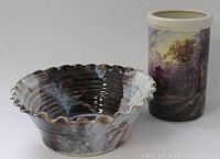 Photo showing the pottery bowl with scalloped rim and glazed interior and exterior.