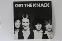 Front cover of the vinyl record album 'Get The Knack' showing band members and title.