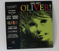Front cover of the Oliver! musical vinyl record showing the artistic green-black illustration and text details.