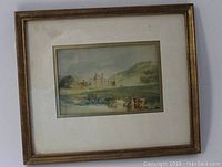 Photo of framed artwork showing entire piece including wood frame and white matte with slight stains.