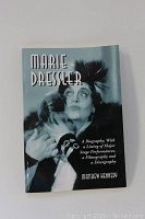Photo of the softcover book titled 'Marie Dressler' with a black and white image of Marie Dressler on the cover.