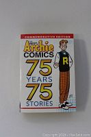 Front cover of 'The Best Archie Comics: 75 Years 75 Stories' commemorative softcover book with Archie character illustration.