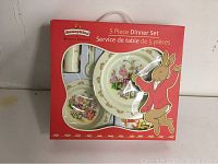 Front of Bunnykins 5 piece dinnerware set box showing clear window with plates and utensils visible, red packaging with Bunnykins logo and colorful rabbit illustration.