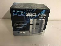 Front view of Power Pod 360° Vibration Speaker box showing model name and image of the speaker.