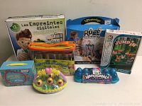 Mixed toy lot showing all items in packaging including kits, puzzles, and collectibles.