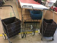 Three collapsible shopping carts side by side showing metal frames, brown fabric bags, and wheels.