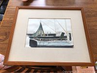 Framed watercolor painting viewed from above showing fishing boat and surrounding dock