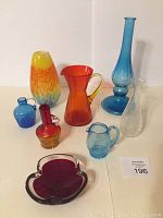 Full view of all crackle glass items arranged on a white surface.