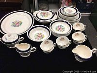 Soho Pottery Ambassador Ware dinnerware set with cups, bowls, cream and sugar, gravy boat, covered dish, and large oval platter