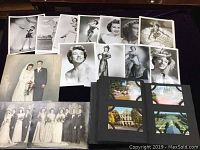 Overview of 11 black and white Zena Cheevers photos, 3 wedding photos including hand-coloured bridal portrait, and postcard album with color postcards.