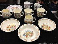 Photo showing 3 Royal Doulton Brambly Hedge series bowls with rabbit border and 5 assorted character mugs including Wedgewood Peter Rabbit, Royal Albert Beatrix Potter, and Royal Doulton Bunnykins.
