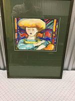 Full view of the framed watercolor artwork showing the subject and mat within the frame.