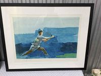 Framed limited-edition watercolor-style print showing a tennis player lunging to hit a ball, blue and gray tones.