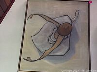 Full view of signed abstract painting laid flat