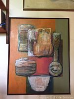 Full front view of the framed oil painting showing entire abstract composition