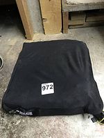 Top view of black Roho cushion with a '972' label on top.