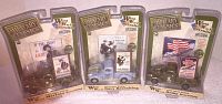 Three sealed Military Classics 1941 Chevy World War II Recruiter trucks in packaging showing Marines, Navy, and Army versions.