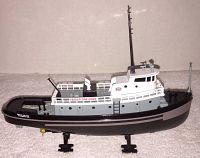Side view of Texaco Fire Chief tug boat bank showing hull and deck details.