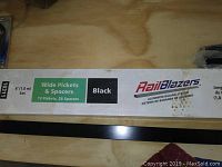Box label detail showing RailBlazers brand wide pickets and spacers in black, 6ft set containing 13 pickets and 28 spacers.