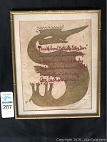 Front view of framed silk screen broadside titled "Glory Never Guesses" by Kenneth Patchen featuring a stylized animal figure with text.