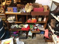 Shelving unit filled with multiple items including boxes, note cards, and other assorted items