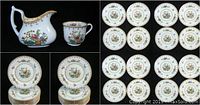 Creamer and demitasse cup with salad plates and bread and butter plates visible.