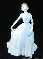 Front view of the Royal Doulton woman figurine in white gown.