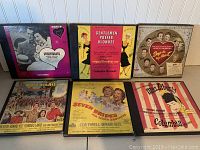 Photo shows six box sets of 78 RPM records featuring classic Broadway musicals with their colorful covers.